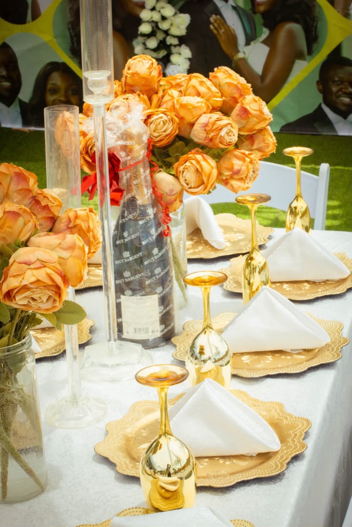 Gold rose bouquet with gilded glassware close-up